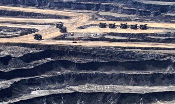 The process to turn dirt into Sell Phones requires two open pit mines; one for the minerals, and one for the coal to process the minerals.